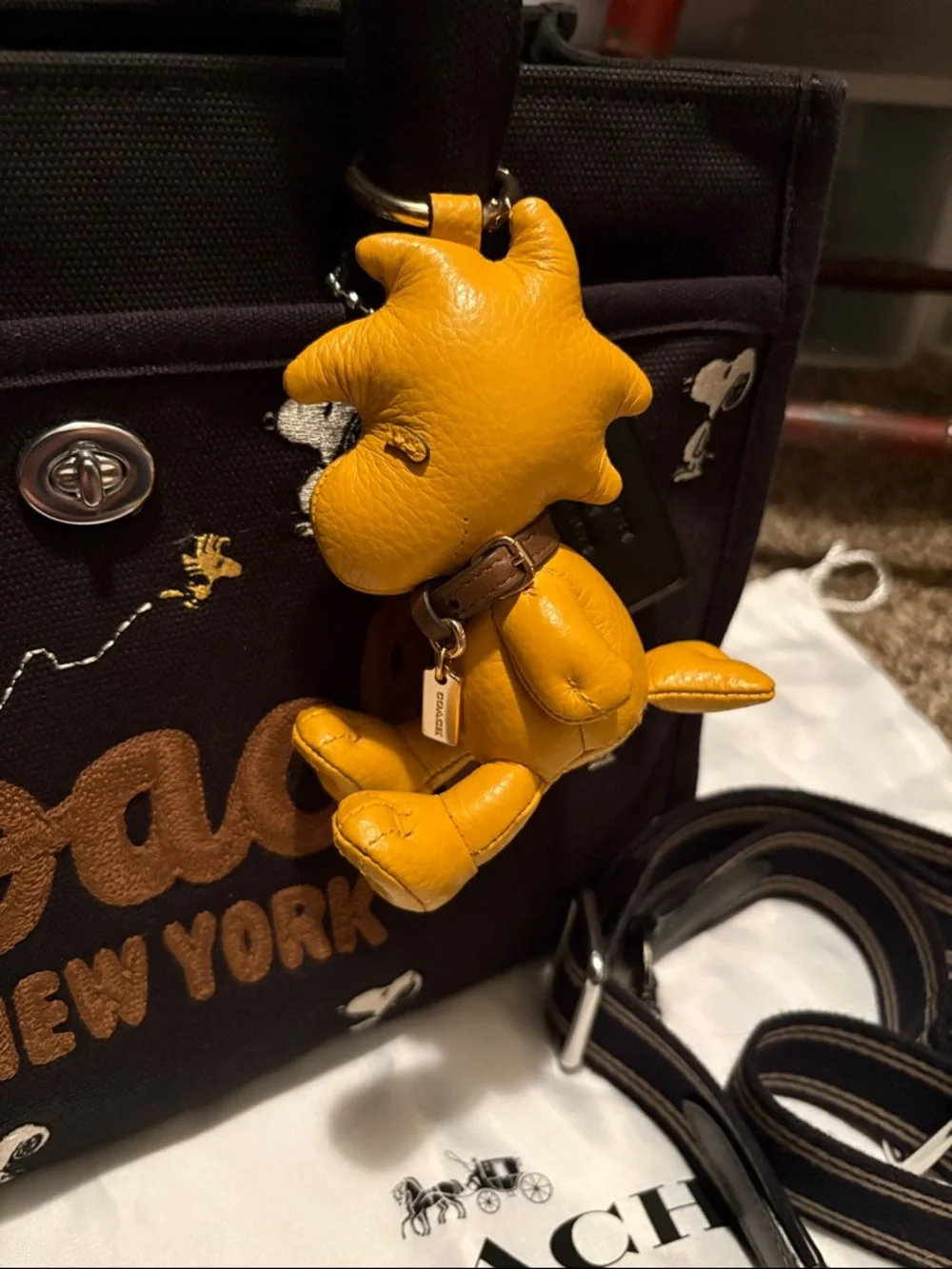 Coach X Peanuts Snoopy Black Canvas Tote with Yellow Woodstock Charm - Picture 2 of 9